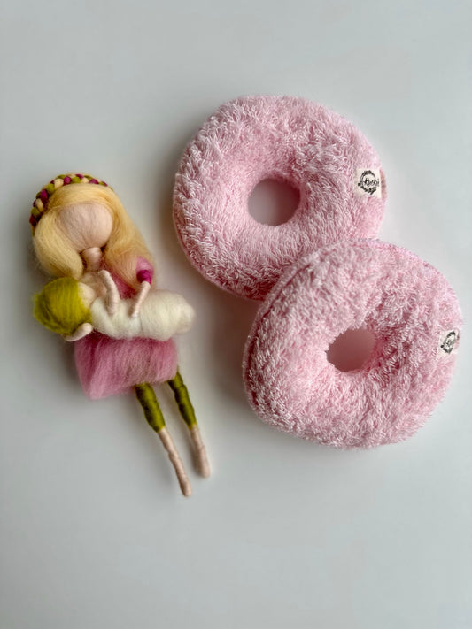 Waschbare und trocknergeeignete Brustdonuts (Möppis) verschiedenfarbig in rosa.